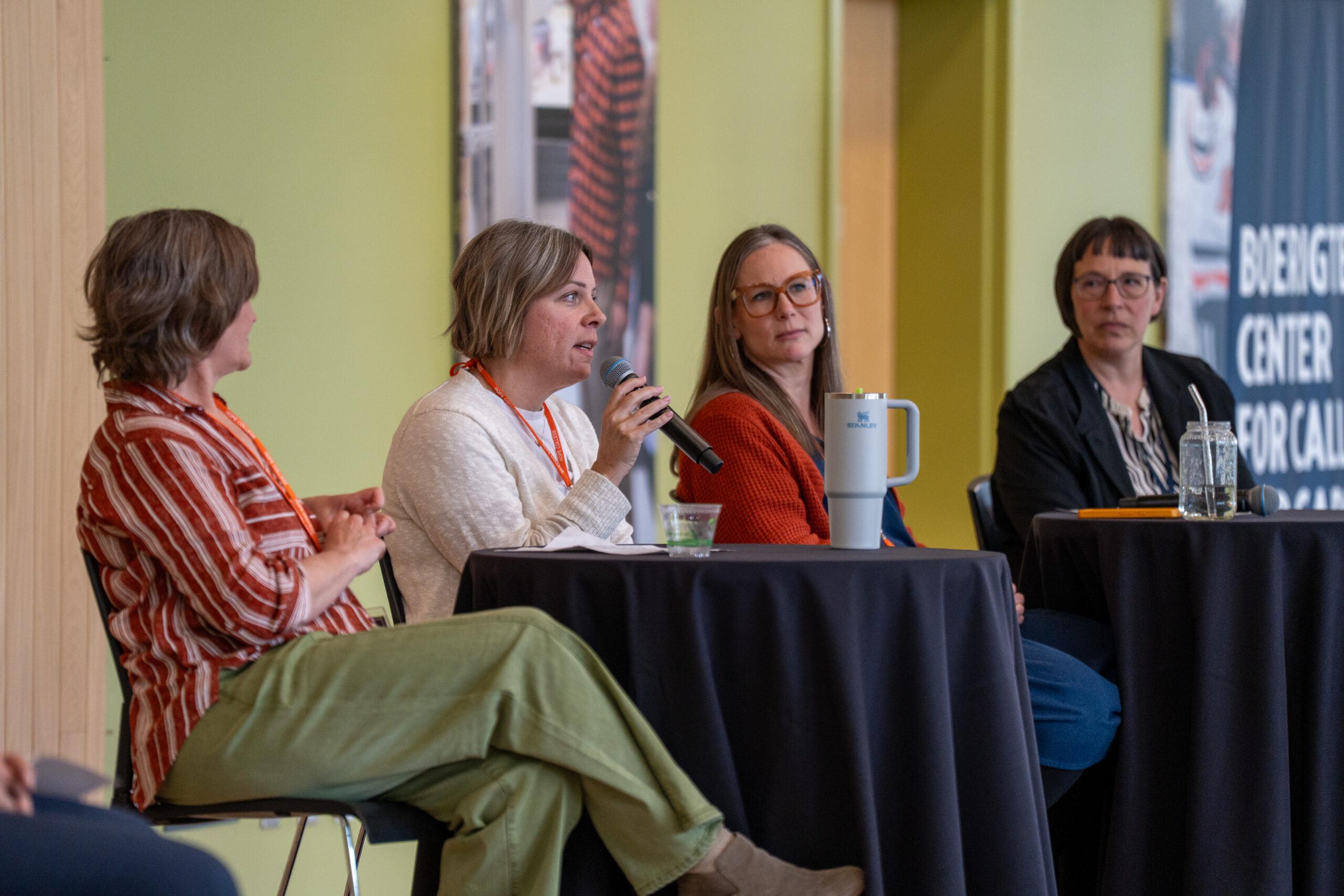 Four panel speakers in discussion at the 2025 NetVUE gathering at Hope College.