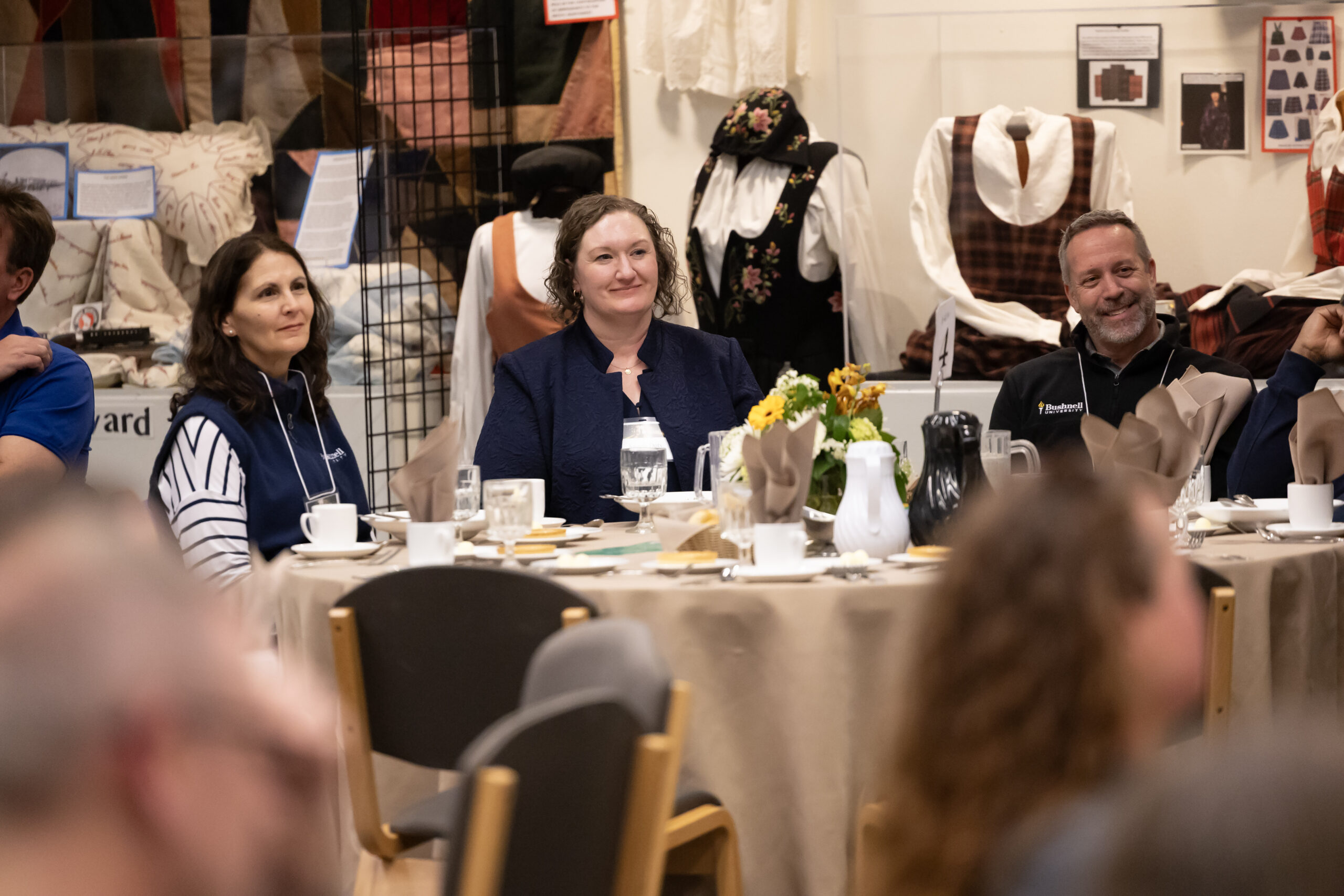 A woman listens to a speaker at the 2025 NetVUE regional gathering at Pacific Lutheran University.