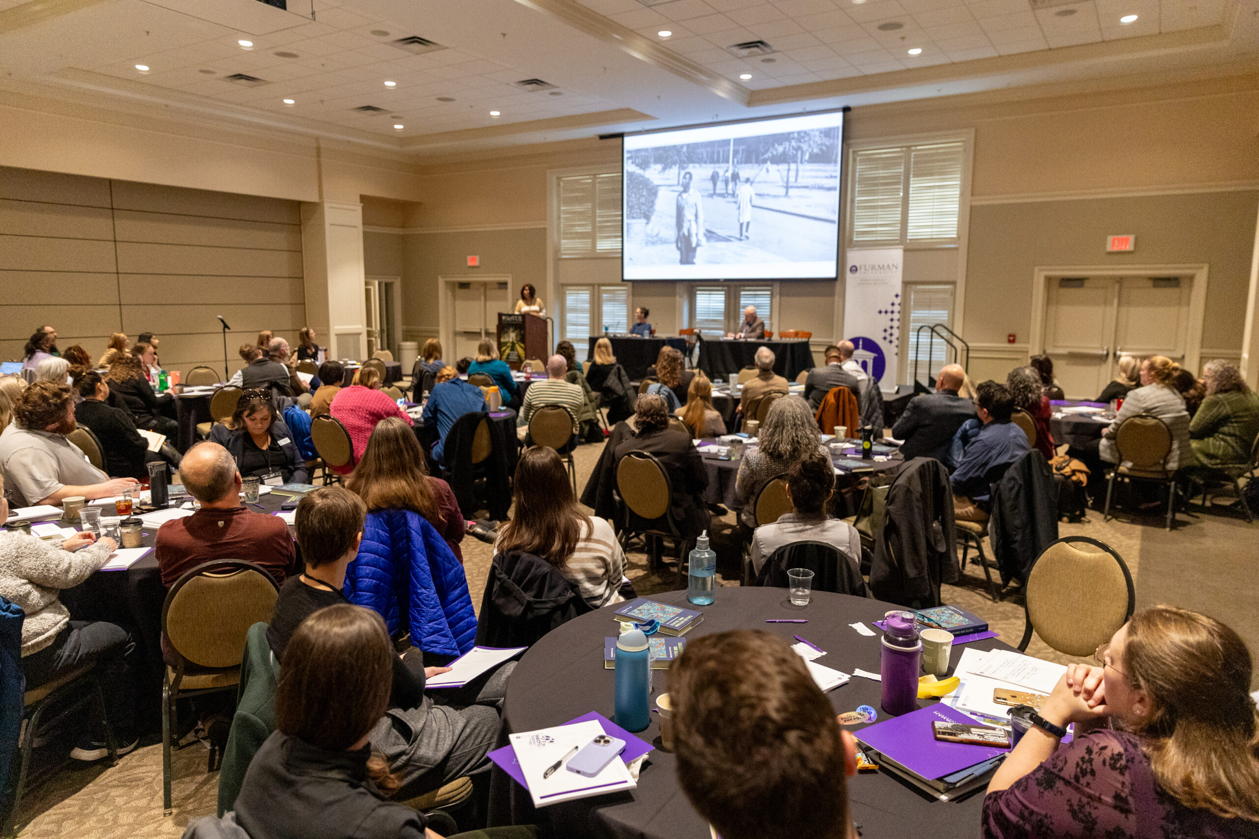 Participants listen to a speaker during the 2025 NetVUE regional gathering at Furman University.