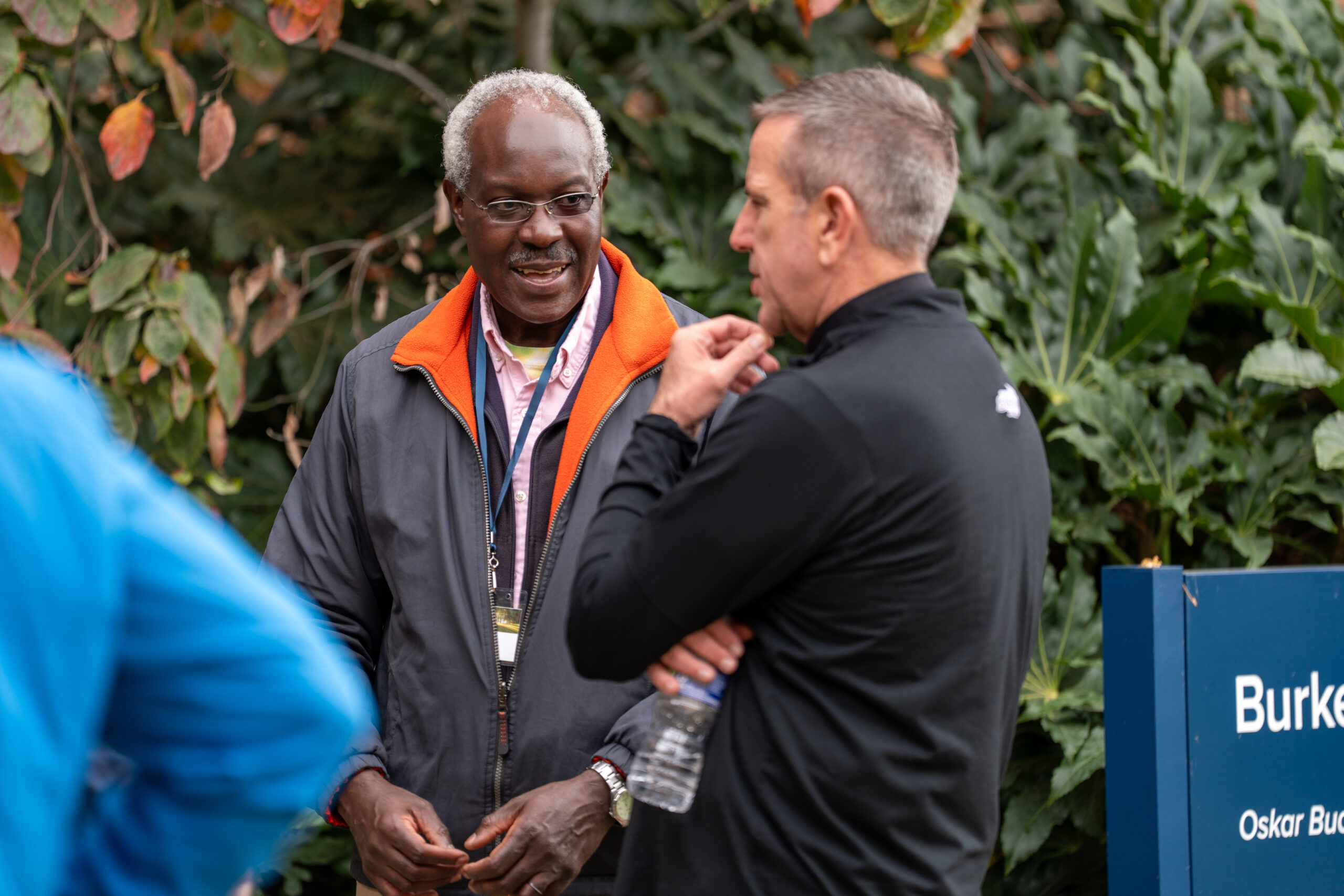 Two men talking in between sessions at the 2025 NetVUE regional gathering at Bushnell University.